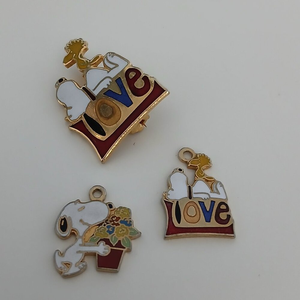 Vintage Snoopy pin and two charms